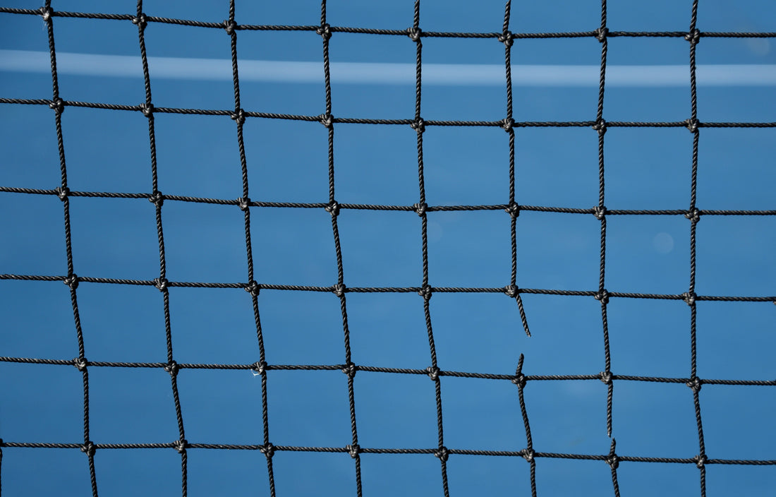 girl playing pickleball in a visor