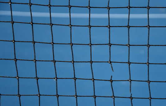 girl playing pickleball in a visor